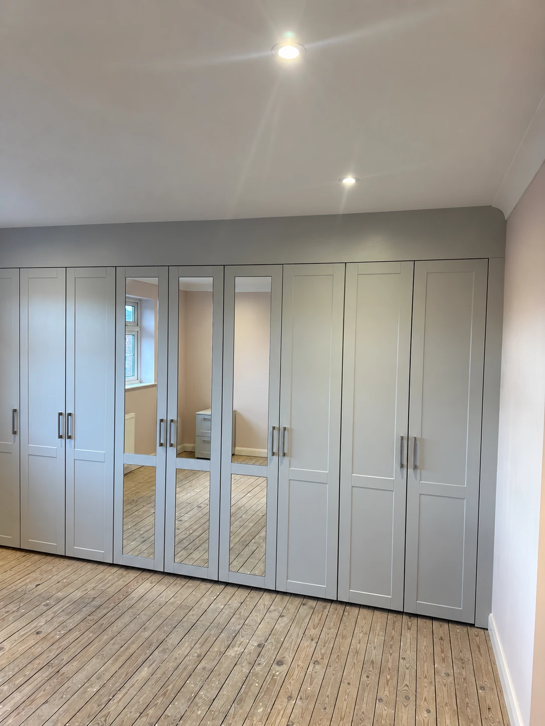 Fitted wardrobes with mirrored doors