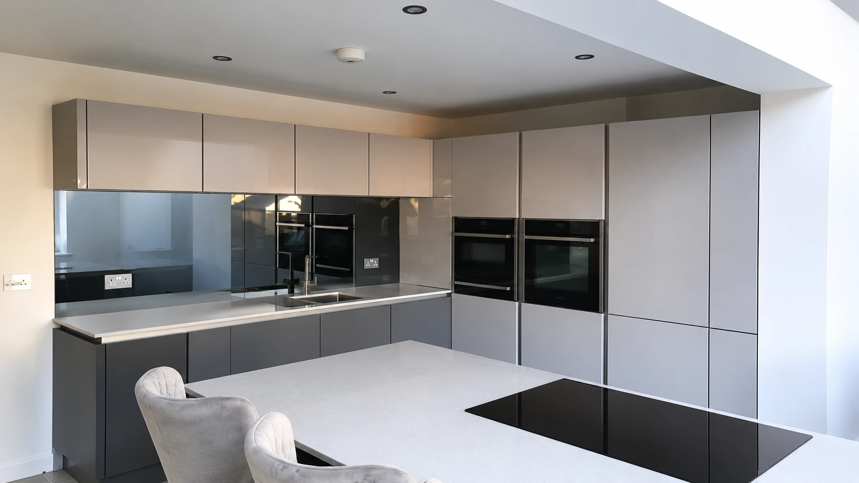 Completed CIS handleless kitchen with fitted cabinetry and island