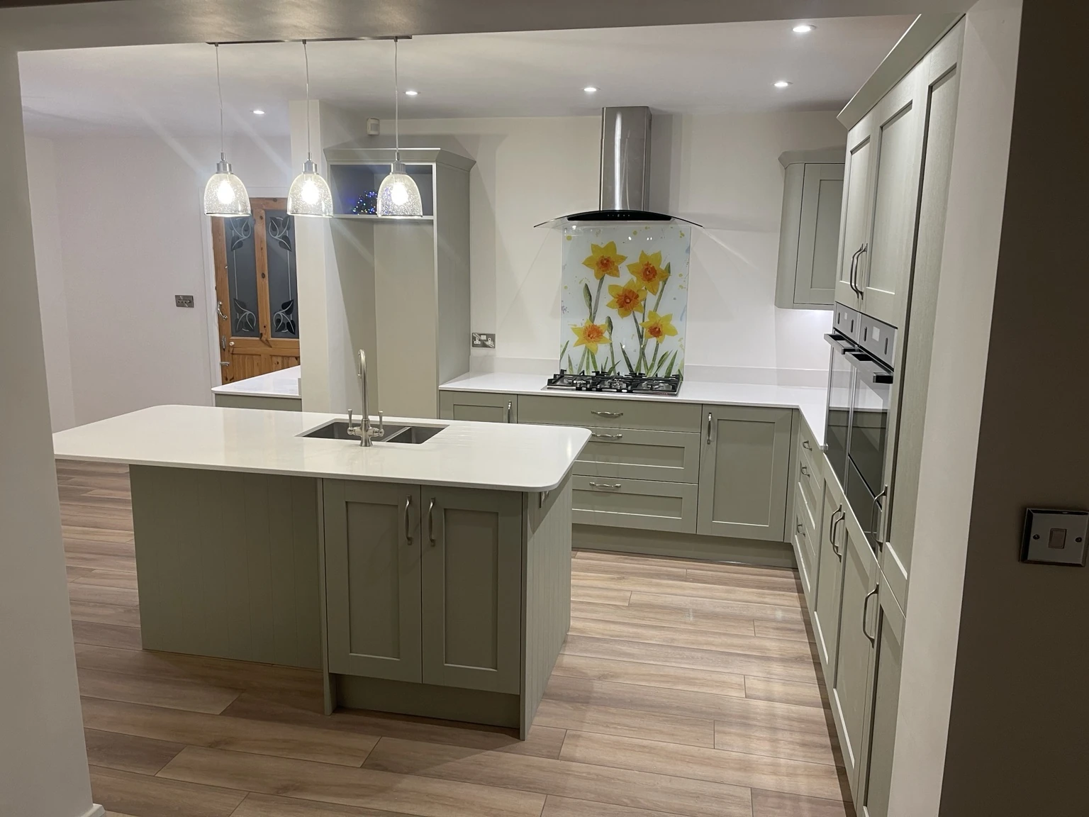 Kitchen installation with island and pendant lighting